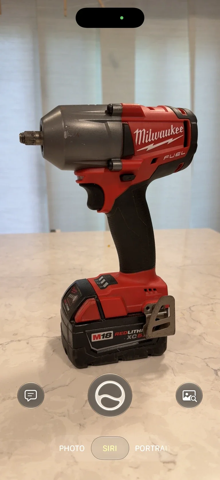 Siri Camera pointed at a Milwaukee impact wrench, ready to find its saved inventory record